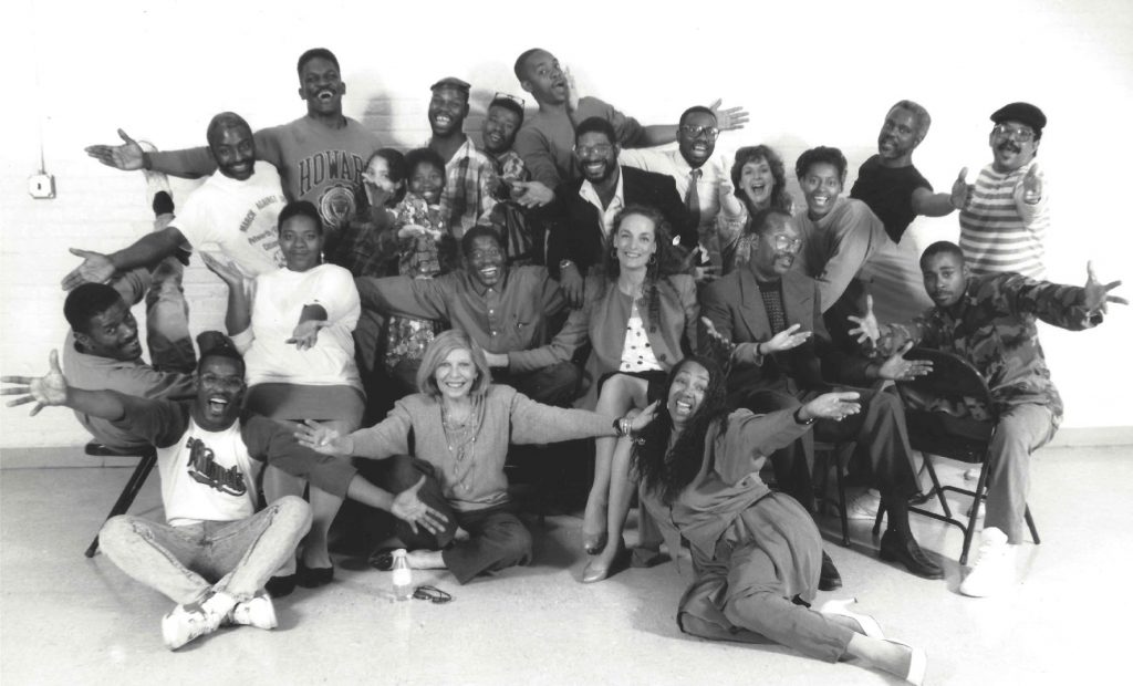 Nancy Wyatt with homeless people rehearsing for performance. Their stories were turned in the book, Three Hots and a Cot, Stories of Courage from People Struggling with Homelessness, Addiction, and AIDS.