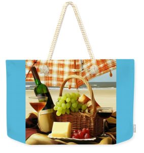 Nancy's Novelty Photos on Pixels Products a picture of wine, grapes, and cheese in a picnic basket at the beach on a tote bag.