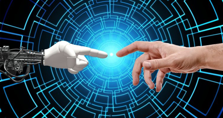 A robot hand and a human hand with fingers pointed toward each other as AI is used. Image by Gerd Altmann