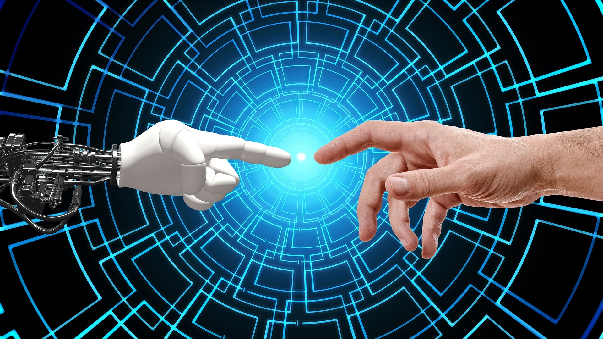 A robot hand and a human hand with fingers pointed toward each other as Artificial Intelligence is used. Image by Gerd Altmann