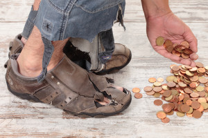 poverty-stricken homeless man's feet in tattered shoes and his hand reaching for coins is among the samples of images created in words in Nancy's book about homeless folks.