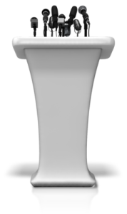 podium_with_many_microphones_400_clr_11679 smaller to depict samples of Nancy's writing that became speeches, classes, or performing arts presentations