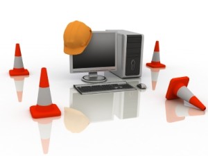 orange cones and computer screen with hard hat on it signifying The Occasional Poet site is under construction