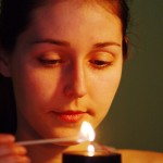 woman lighting cancle MS Clip Art